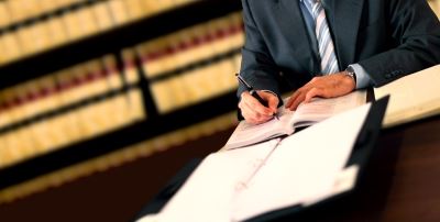 Man Signing Documents